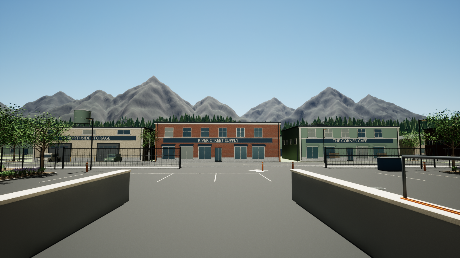 Shops and a mountain skyline beyond the warehouse loading bay